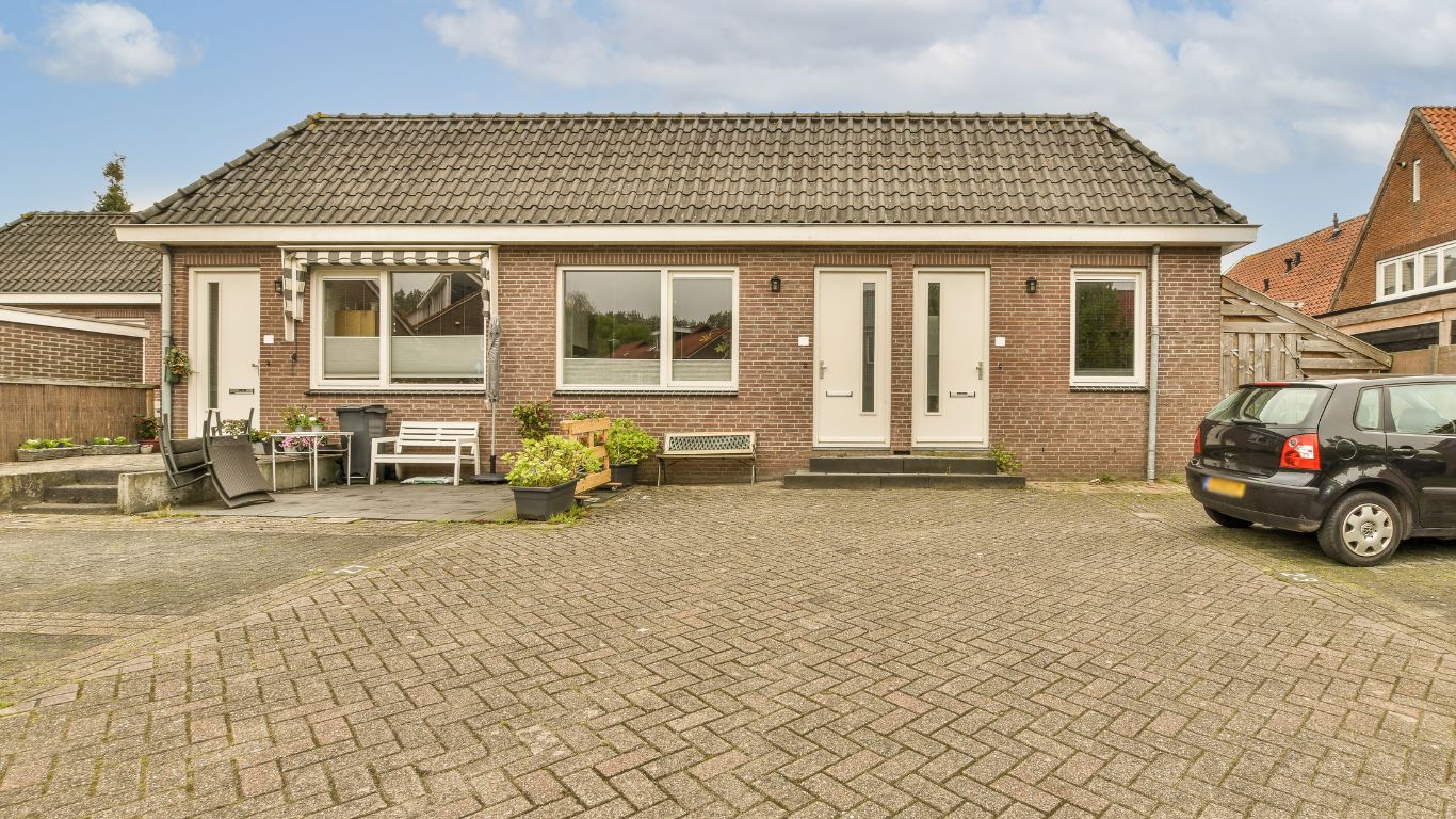 car parked in the paver driveway home front